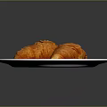 Golden Flaky Croissants Placed On A White Plate For Morning Meal