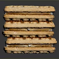 Stacked Crispy Crackers With Textured Surface And Golden Brown Layers