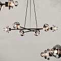 Modern Hanging Chandelier With Glass Ball Elements And Black Metal Frame For Interior Design