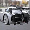 White Streamlined Sports Car With Modern Racing Inspired Design In Showroom