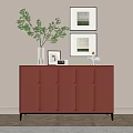 Red Textured Entryway Cabinet Sideboard With Green Plant Picture Frames On Light Wall