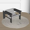 Minimalist Leisure Chair With Dark Frame Light Fabric On Round Woven Rug And Open Book