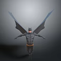 Man in Batman Costume with Large Wings Standing on Gray Background