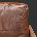 Two Views Of Brown Leather Single Sofa With Wooden Frame And Vintage Design