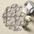 Round Rug With Geometric Patterns In Neutral Tones Living Room Gray Sofa And Potted Plant