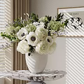 Decorative Ornament Set With White Flowers Dark Centers Green Plants White Vase And Marble Tabletop