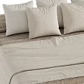 Cozy Double Bed With Neutral Toned Linen Bedding Striped Plaid Patterns And Pillows