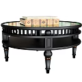 Round Black Tiered Coffee Table With Glass Top Decorative Legs And Books On Top