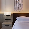 Modern Hotel Guest Room Interior With White Bed Nightstand Lighting And Carpet