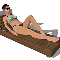 Woman Wearing Bikini Lying On Wooden Lounge Chair With Sunglasses And Towel