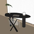 Modern Minimalist Black Oval Desk With Notebook Pen Clear Glass And White Sphere Decor
