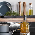 Modern Gray Cookware Set With Pots Pans Knife Block And Olive Oil On Kitchen Counter