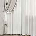 Elegant Beige Curtains with Sheer White Lining and Decorative Tiebacks on White Walls