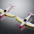 Two White Passenger Plane Models With Yellow Edges Pink Tails And Propellers On Gray Background 3d model