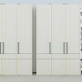 Modern Minimalist Wardrobe With Light Colored Panel Doors And Metal Handles