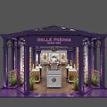 Elegant Grandiflora Shop Interior With Purple Display Shelves Marble Counters Green Plants And Ceiling Lighting