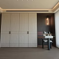 Modern Textured Beige Wardrobe Interior With Brass Handles Wooden Wall And Dressing Table
