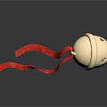 Golden Bell Ornament with Red Ribbon on Dark Background and Shiny Reflection