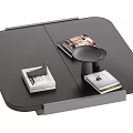 Modern Black Coffee Table With Stacked Books And Small Tray On Top