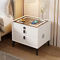 Modern White Nightstand With Drawers Black Handles Yellow Cup Blue Book And Vase In Bedroom