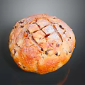 Fresh Round Raisin Bread with Cross Slits Golden Brown Surface and Dried Fruits Inside