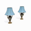 Two Elegant Table Lamps With Light Blue Shades And Ornate Brass Bases