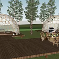Scenic Camping Site with Dome Tents Wooden Deck and Outdoor Dining Area