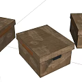 Three Brown Wooden Storage Boxes With Handles And Decorative Patterns