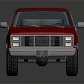 Red Vintage SUV with Classic Front Grille and Rugged Off Road Tires