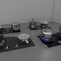 Essential Kitchen Cookware Including Pots and Pans on Gas Stoves with Blue Flames