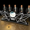 Modern Reception Desk with Five People in Suits Behind Geometric Light Design BAS Logo and Globe