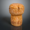 Textured Champagne Cork With Engraved CHAMPAGNE Lettering Isolated On Dark Background