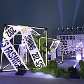 Suning 2022 EIG Stage Setup With Staircase Geometric Decorations Green Plants And Lighting