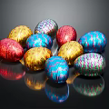 Decorative Ornament Set With Colorful Foil Wrapped Shiny Multi Colored Easter Eggs On Black Background