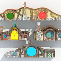 Hobbit Style Architecture with Colorful Round Doors Stone Walls Wooden Beams and Chimneys Design Features