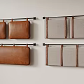 Different Material Wall Mounted Cushions With Leather Trim Hanging On Metal Rods 3d model