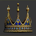 Golden Crown Sculpture with Intricate Carving Decorated with Blue Gemstones and Elegant Design