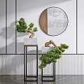 Bonsai Potted Plants On Black Stands With Round Mirror And Striped Wall Decor