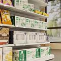 Well Organized Retail Display Shelves With Multi tiered Racks Holding Packaged Cereals Canned Goods And Boxed Products