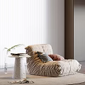 Beige Lazy Sofa With Small Round Table Books Green Plant White Blinds And Wooden Floor