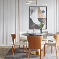Round Marble Top Dining Table Set with Gold Base Beige Orange Chairs Green Decorative Plant