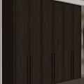 Modern Wardrobe With Sleek Panels And Metal Handles Near Curtains And Plant