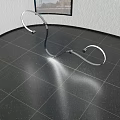 Abstract Metallic Sculpture On Polished Floor With Window And Textured Wall Background