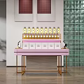 Pink Display Shelf With Golden Bottles White Boxes And Golden Frame On Wooden Floor