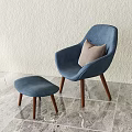 Modern Blue Upholstered Leisure Chair With Sturdy Wooden Legs Matching Footstool And Soft Beige Pillow