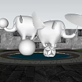 Stainless Steel Elephant Sculpture in Urban Garden with Fountain Balls Palm Trees Against High Buildings