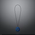 Elegant Blue Pendant With Gold Pattern Hanging On Black Cord Design