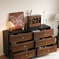 Wooden Dresser With Gold Handles Table Lamp Butterfly Decor And Floor Lamp
