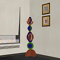 Modern Colorful Circular Stacked Sculpture in Living Room with Fireplace and Wall Art