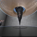 Spiral Art Installation With Black Pointed Structure Red Details And Blue Lighting
